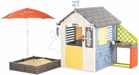 Spielhäuser mit Sandkasten - Das Spielhaus Wetterstation mit Sandkasten unter dem Sonnenschirm Vier Jahreszeiten Spielhaus Smoby