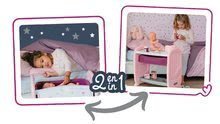 Postieľky a kolísky pre bábiky - Set postieľka k posteli s prebaľovacím pultom Violette Baby Nurse 2v1 Smoby s cikajúcou bábikou a s nočným úborom a dvoma šatôčkami_2