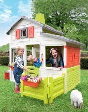 Spielhäuser Friends House Smoby - Spielhaus Neo Friends House DeLuxe Smoby mit zwei Spielküchen und Tischen mit einem Sonnenschirm mit Umzäunung_13