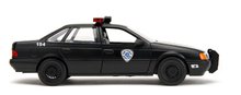 Modely - Autko RoboCop Ford Tarus 1986 Jada metalowe z otwieranymi częściami i figurką Robocopa o długości 20 cm, 1:24_1