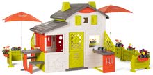 Spielhäuser Friends House Smoby - Spielhaus Neo Friends House DeLuxe Smoby mit zwei Spielküchen und Tischen mit einem Sonnenschirm mit Umzäunung_0