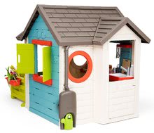 Kleine Spielhäuser für Kinder - Häuschen mit Gartenrestaurant Chef House DeLuxe Smoby mit zwei Tischen und einem Garten_1